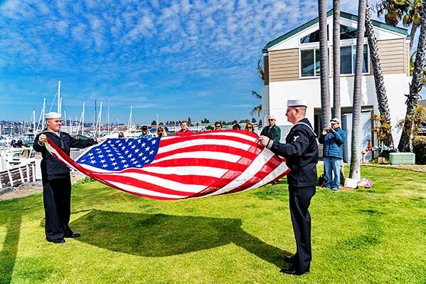 Flag being folded before sea burial